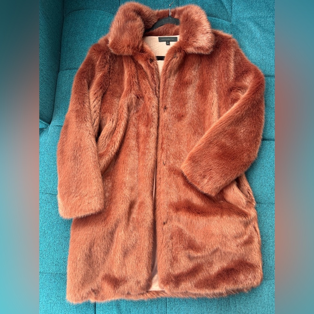 Fun, long, dusty rose color faux fur. Great with jeans or dresses.